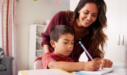 a woman helping a child with homework